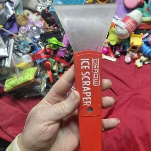 Osrow ice scraper, featuring a thick plastic blade 10" Red